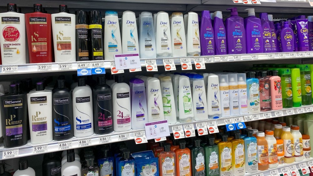 Shampoo and conditioner aisle at a store. 