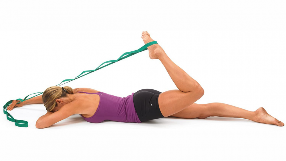 Woman stretching with a stretching strap