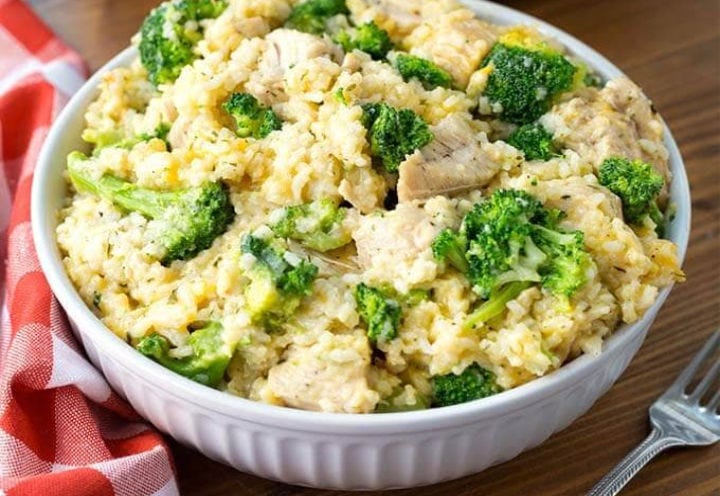 A white bowl filled with chicken broccoli and rice "casserole"