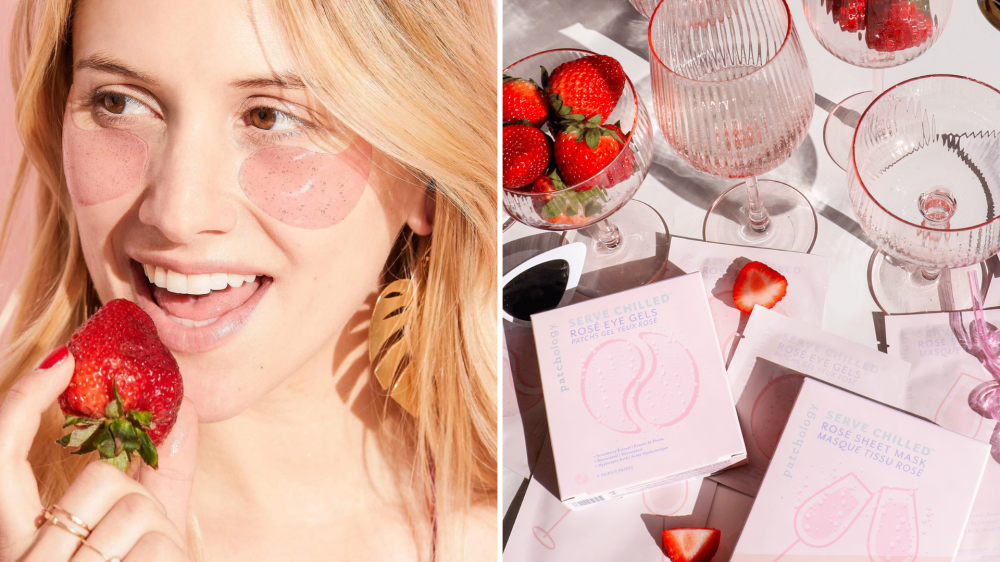 A woman wears eye gel patches while eating a strawberry, and eye gels are placed on a table filled with pink glasses and strawberries.