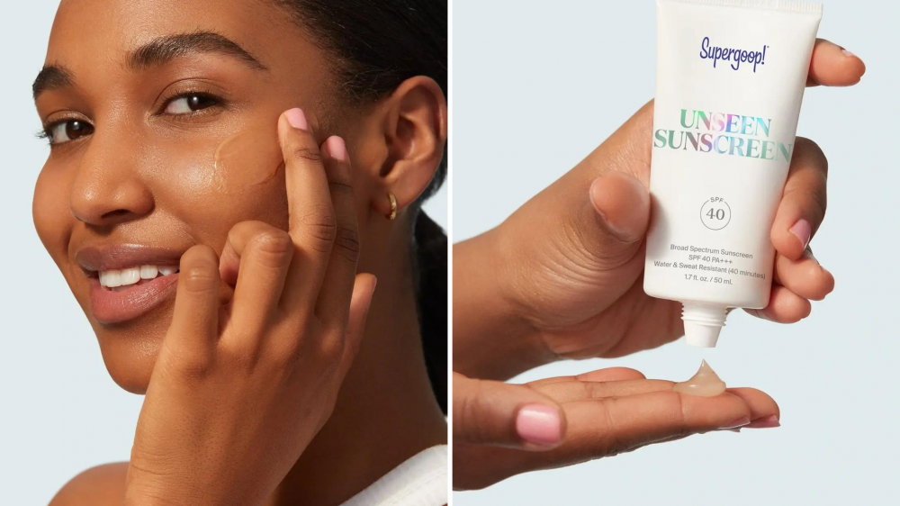 A woman applies sunscreen to her face, and a person applies sunscreen to her fingertips.