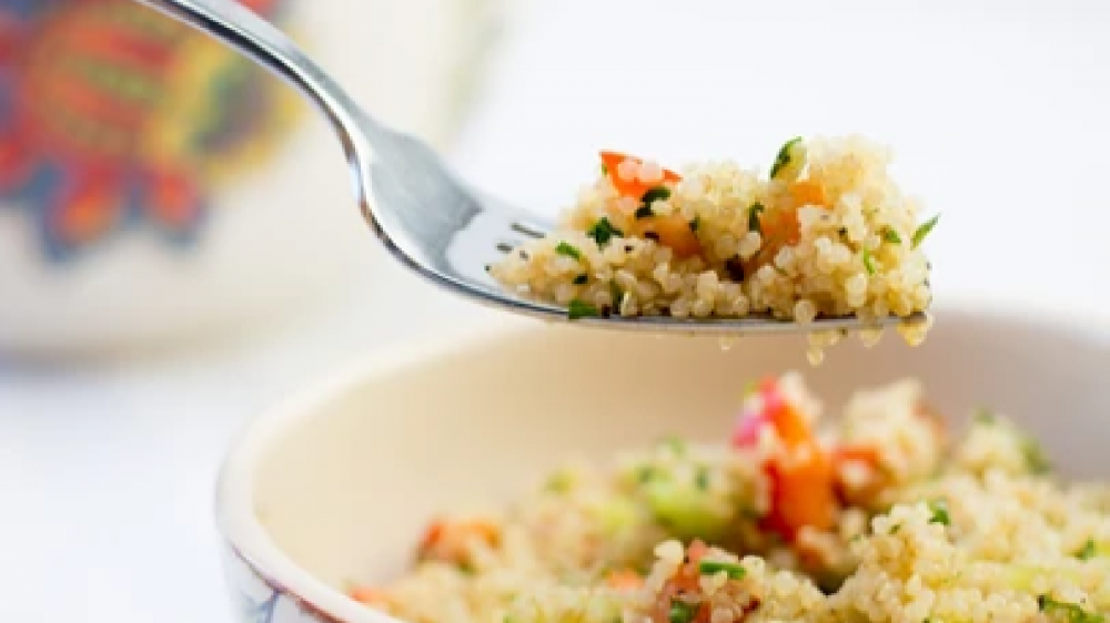 Quinoa close up on a fork.